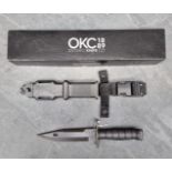 An Ontario Knife Co. 'M9' knife and sheath, having 18cm blade, boxed.