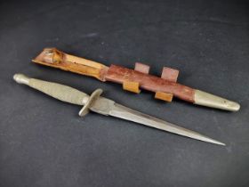 A rare circa 1940 Fairbairn-Sykes first pattern commando fighting knife and leather sheath, by