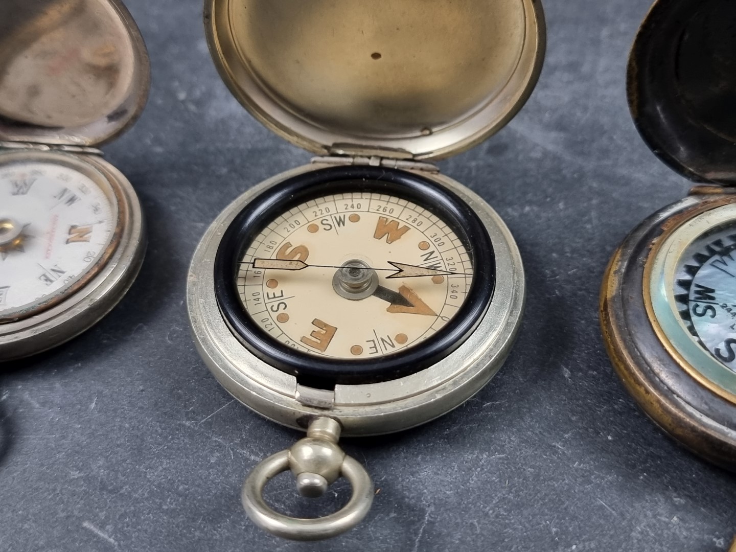 Two WWI military style nickel plated compasses; together with two other pocket compasses. (4) - Image 3 of 5