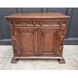 An antique oak panelled side cabinet, 102.5cm wide.