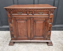 An antique oak panelled side cabinet, 102.5cm wide.