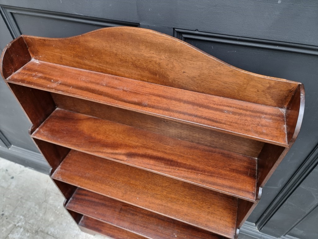 A reproduction mahogany open waterfall bookcase, 78cm wide. - Image 2 of 3