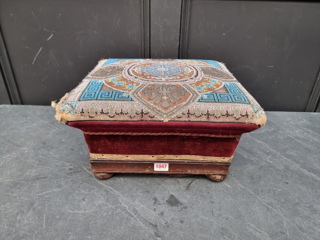 A Victorian beadwork footstool, 38.5cm wide.