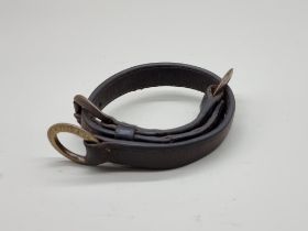 A Victorian brass and leather dog collar, inscribed 'Alfred A Grosvenor, Guys Hospital', further
