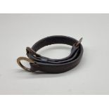 A Victorian brass and leather dog collar, inscribed 'Alfred A Grosvenor, Guys Hospital', further