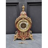 A Louis XV style simulated tortoiseshell Boulle mantel clock, 37cm high.