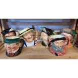 Six Royal Doulton character jugs.