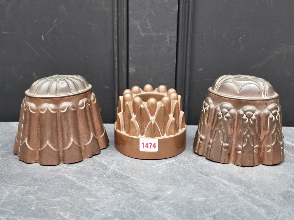 Three antique copper jelly moulds, largest 14cm high. (3)