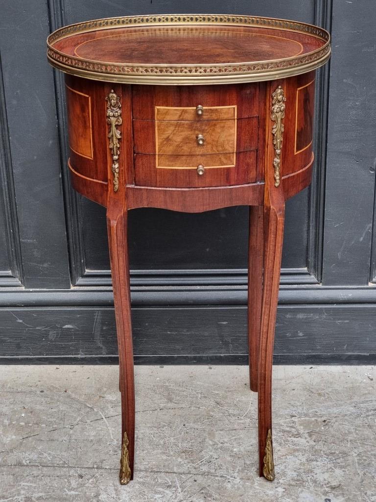 A Louis XVI style mahogany and walnut gueridon, 43.5cm wide.