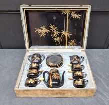 A 1920s/30s Japanese lacquer coffee service, the tray 48.5cm wide, cased.