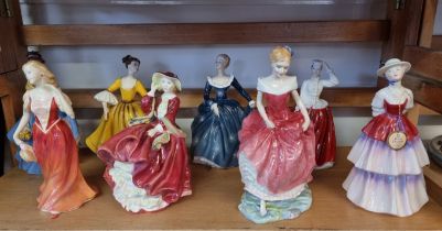 Eight Royal Doulton figures.