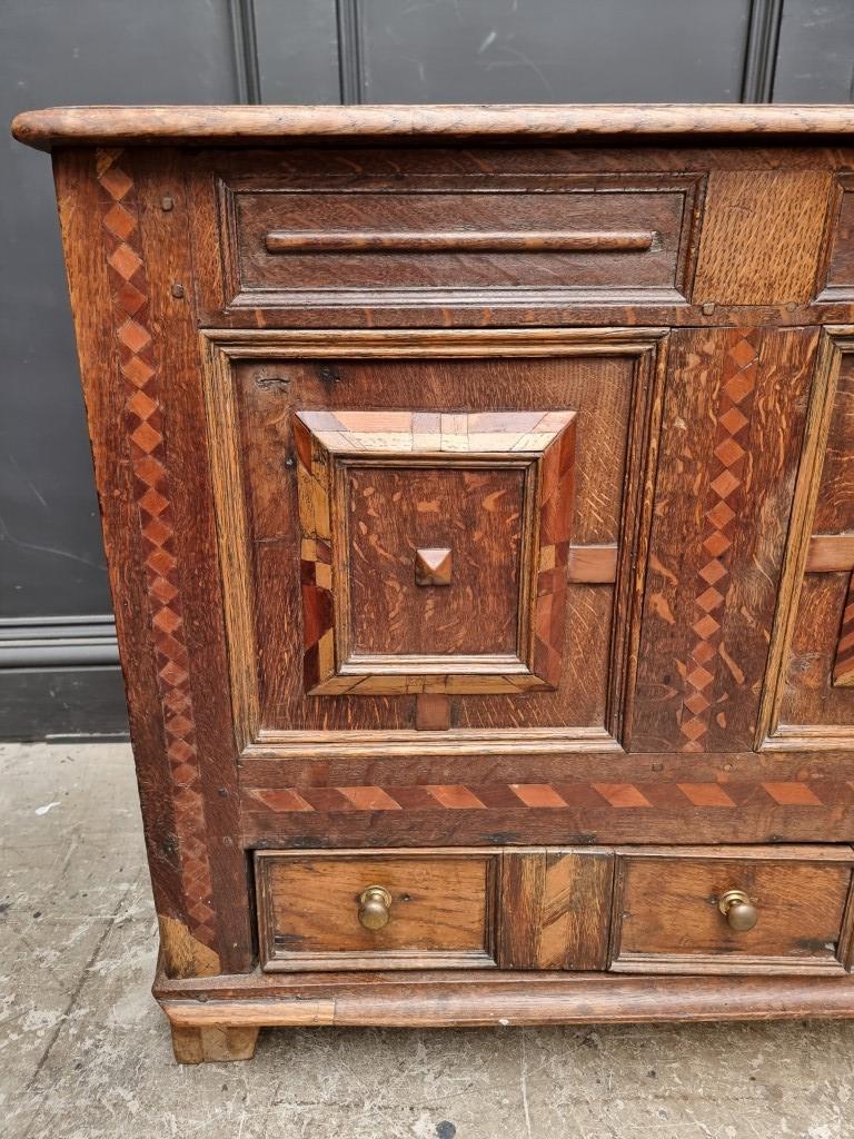 A late 17th century panelled oak and parquetry mule chest, 129.5cm wide. - Image 2 of 11