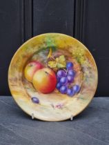 A Royal Worcester fruit painted cabinet plate, circa 1924, indistinctly signed, 18.5cm diameter.