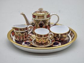 A Royal Crown Derby Imari miniature bachelor's teaset, the tray 19.5cm wide.