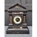 A late 19th century slate and marble mantel clock, 53cm high, with pendulum.