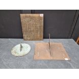 A brass sundial, 31.5cm wide; together with another verdigris sundial; and a brass 'Equation of