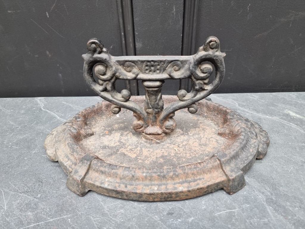 A cast iron boot scraper, 37cm wide.