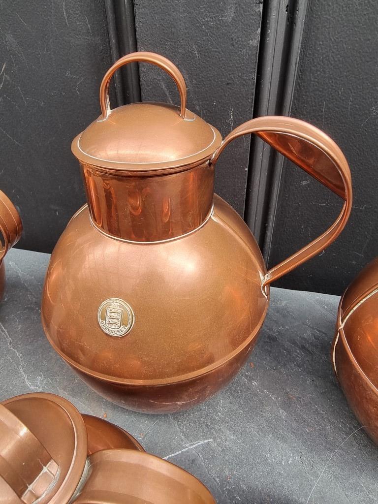 A graduated matched set of six copper Guernsey milk jugs and covers, largest 24cm high; together - Image 2 of 3