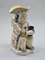 A late 18th century Creamware toby jug, 25cm high, (s.d.).