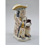 A late 18th century Creamware toby jug, 25cm high, (s.d.).