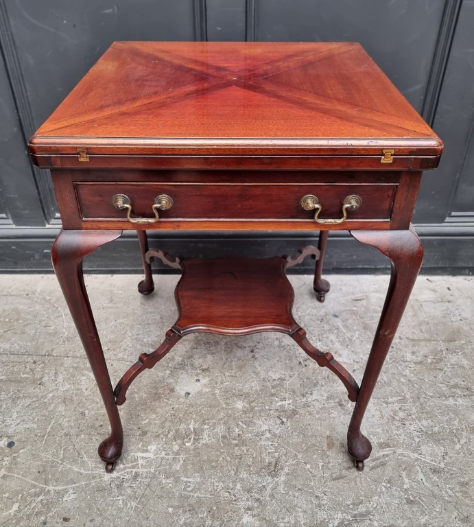 A late Victorian mahogany envelope card table, with frieze drawer and platform undertier, 55.5cm