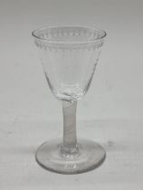 An 18th century incised twist stemmed glass, 12.5cm high.