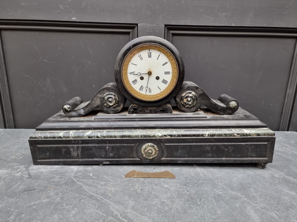 A large late 19th century slate and marble mantel clock, 64cm wide.