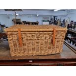 A large wicker hamper, 68.5cm wide.