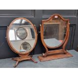 Two Georgian style mahogany skeleton frame toilet mirrors, largest 55cm high. (2)