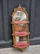 An old giltwood and mirrored glass wall shelf, 106cm high.