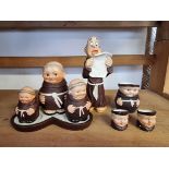 A small group of Goebel novelty monk figures, to include a cruet set.