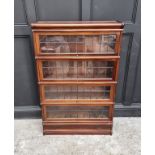 An early 20th century Globe Wernicke mahogany four tier sectional bookcase, with leaded glass
