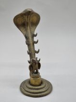 An unusual antique brass novelty serpent and owl desk stand, 28.5cm high.