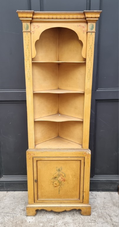 An 18th century style gilt painted standing corner cupboard, 69cm wide.