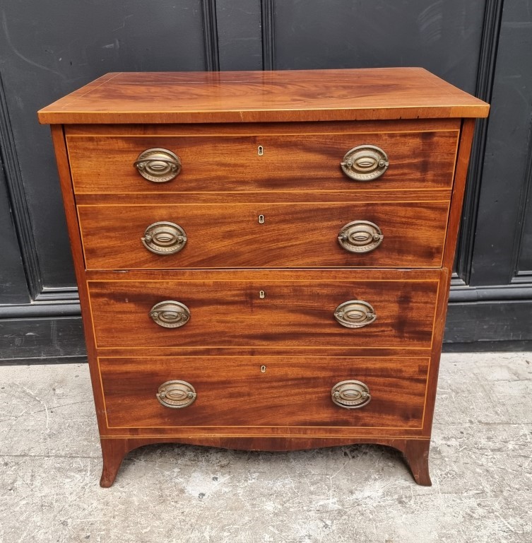 A George III mahogany and line inlaid commode chest, with pottery liner, 64cm wide.