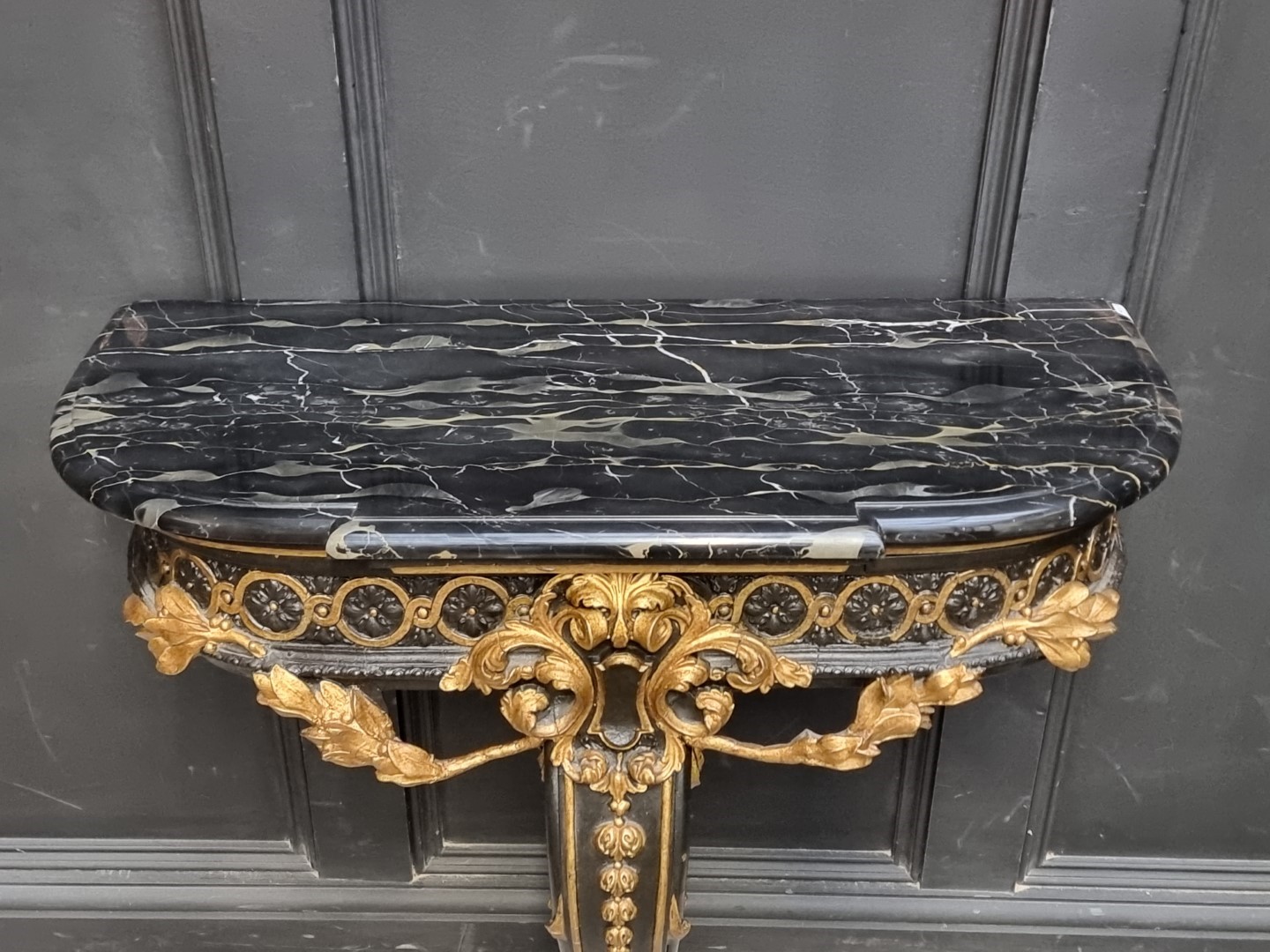 A neo-classical style ebonized, parcel gilt and marble top console table, 78.5cm wide. - Image 2 of 5