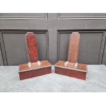 A pair of mahogany and ebonized plate stands, 37cm high.