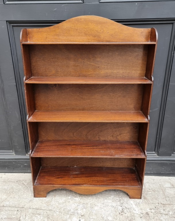 A reproduction mahogany open waterfall bookcase, 78cm wide.