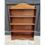 A reproduction mahogany open waterfall bookcase, 78cm wide.