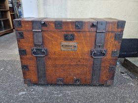 A large late Victorian oak and metal bound silver strong box, bearing brass plaque inscribed 'W.H.