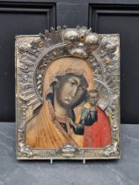 A good late 18th century Russian silver gilt mounted icon of Virgin and Child, tempera on wood