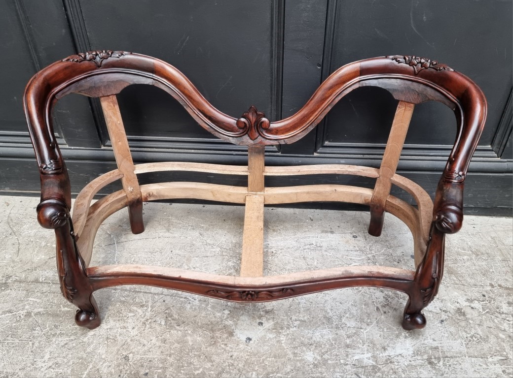 A Victorian style carved walnut childs' settee, 91cm wide.