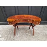 A reproduction mahogany and line inlaid kidney shaped desk, 99cm wide.