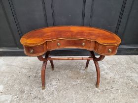 A reproduction mahogany and line inlaid kidney shaped desk, 99cm wide.