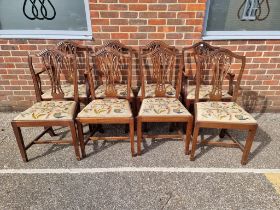 A set of eight George III style mahogany dining chairs, each with tapestry slip in seat, to