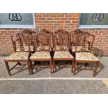 A set of eight George III style mahogany dining chairs, each with tapestry slip in seat, to