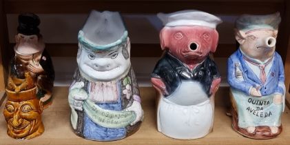 Five novelty character jugs, largest 26.5cm high.