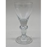 An 18th century glass baluster wine goblet, 18.5cm high.