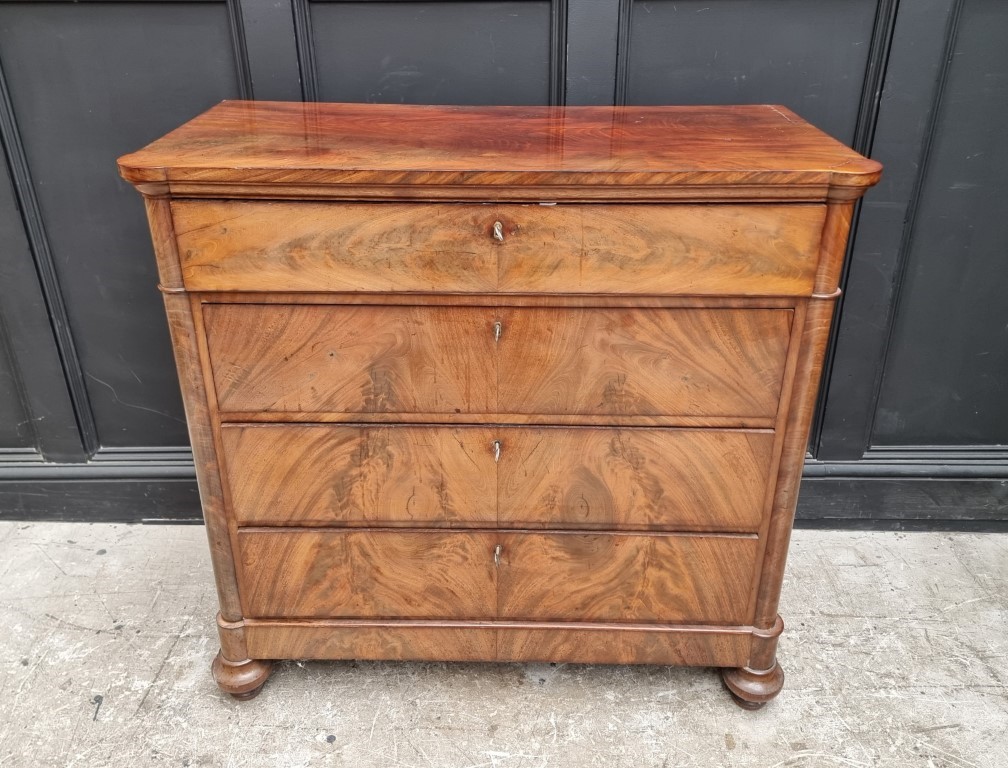 A 19th century Continental figured mahogany chest of drawers, 102cm wide.