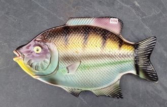 A pottery fish plate, 57cm wide.